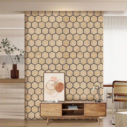Full height wall installation of oak hexagon acoustic panels with minimalist wooden TV stand and decor