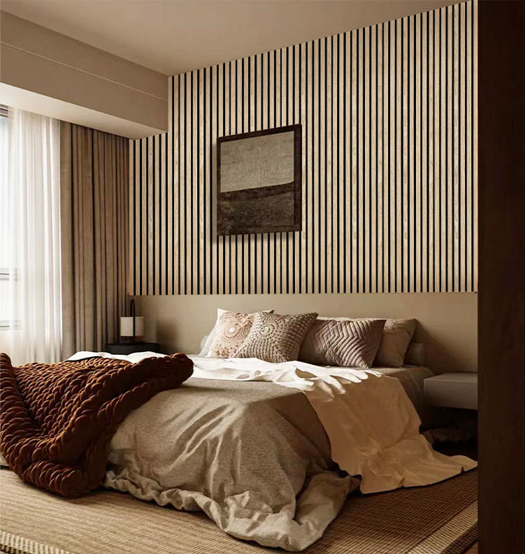 Cozy modern bedroom with beige vertical wood slat wall panels and layered bedding textures