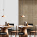 Before and after comparison of a dining room with wooden wall panels.