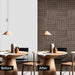 Before and after comparison of dining room showing transformation using American walnut acoustic panels on the wall